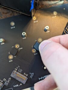 You have to add extra rubber stand-offs for single sided SSDs